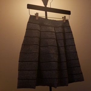 Structured metallic knee-length skirt